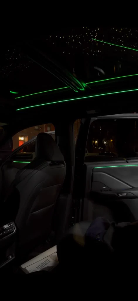 Green ambient lighting across the dash at night