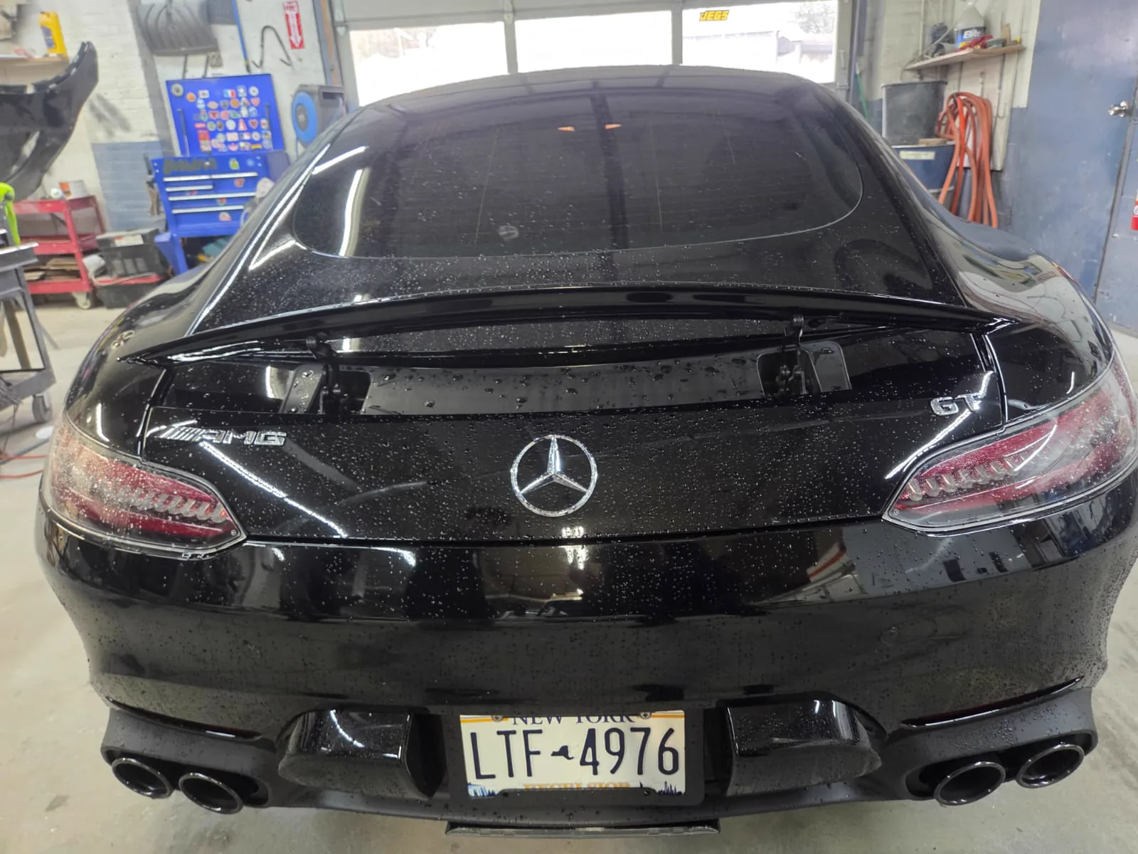 Black Mercedes-AMG GT with a mirror finish after ceramic coating