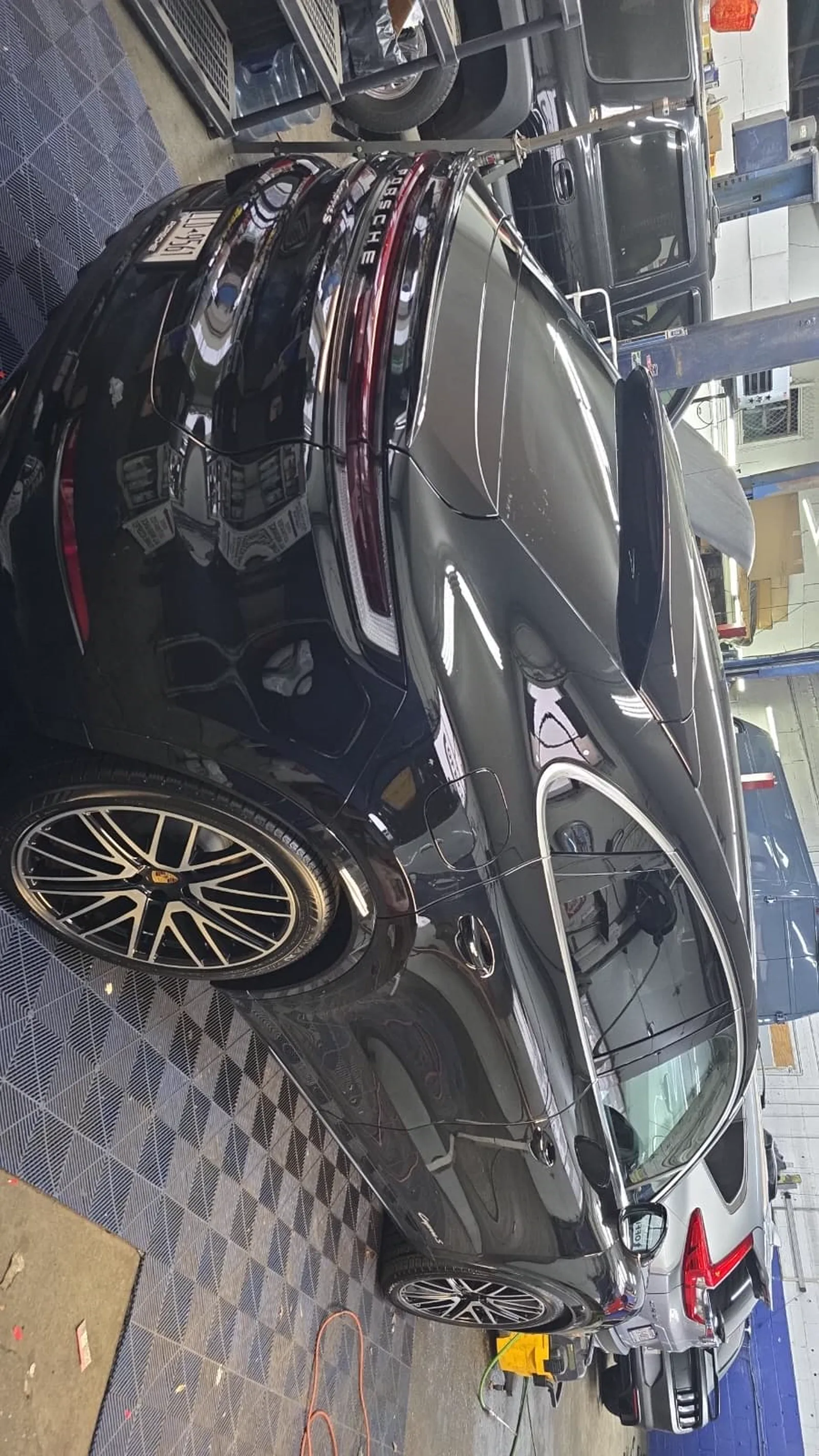 Black car with heavy side damage waiting for teardown