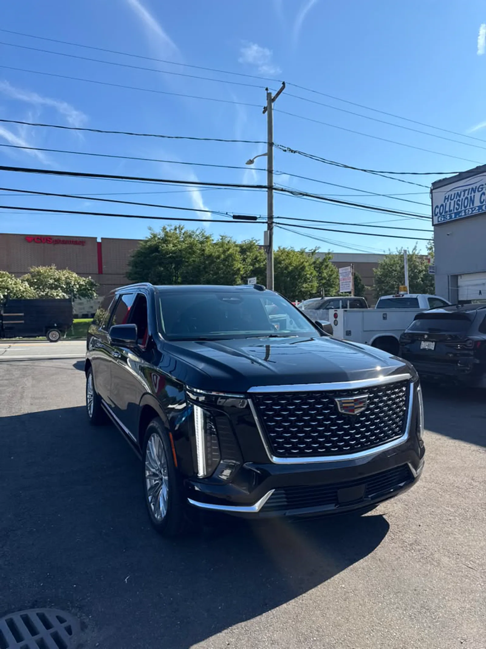 Clean black Cadillac Escalade in the lot after a full detail