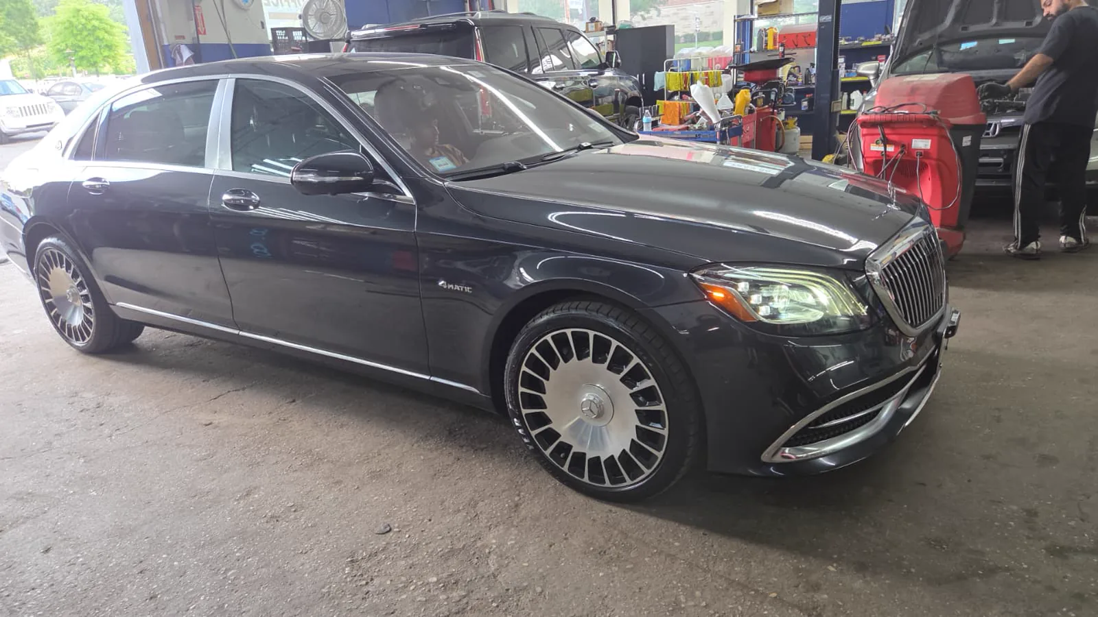 Black Mercedes-Maybach with dark tinted glass and chrome wheels