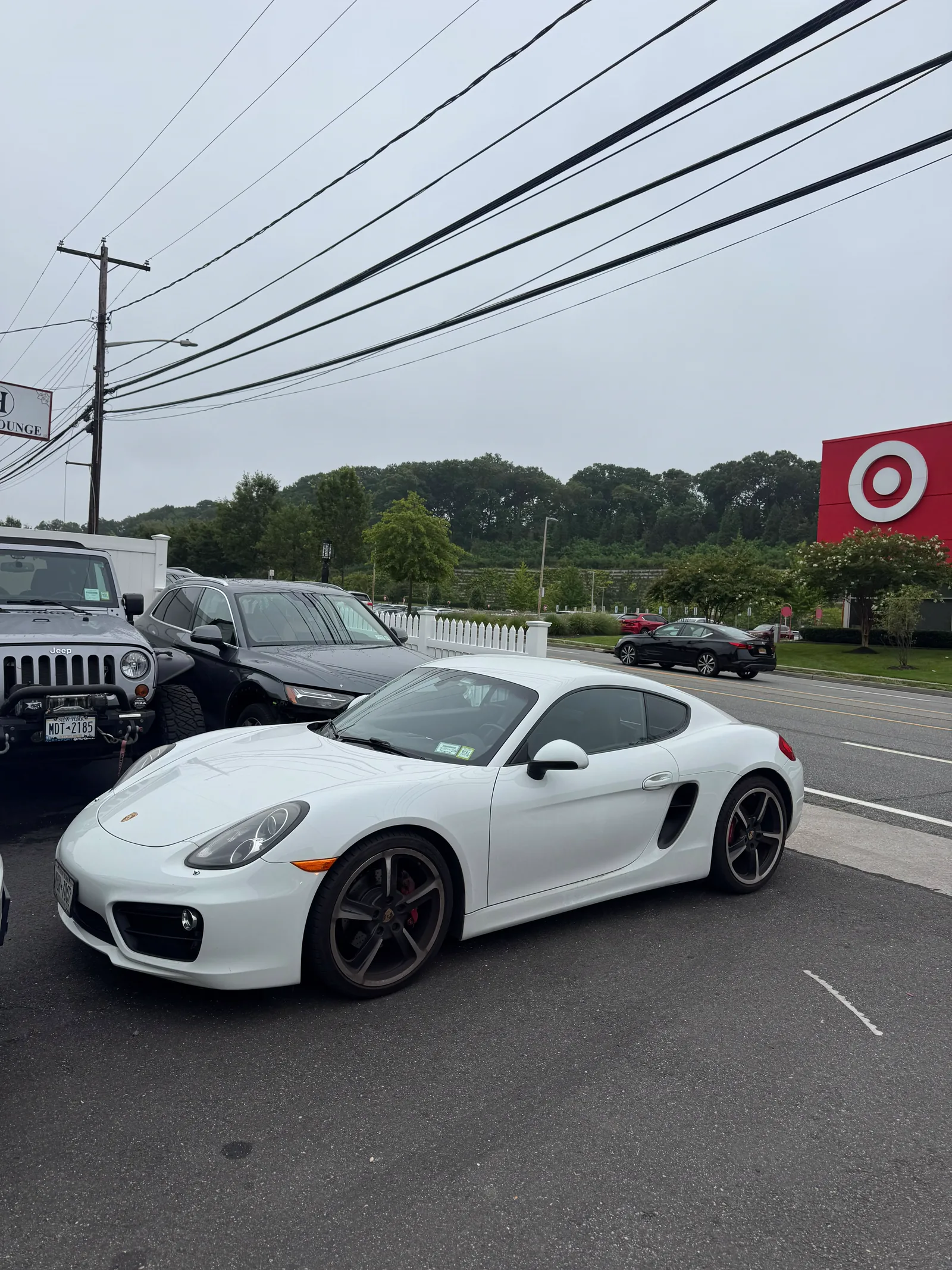 White Porsche Cayman washed and ready for pickup