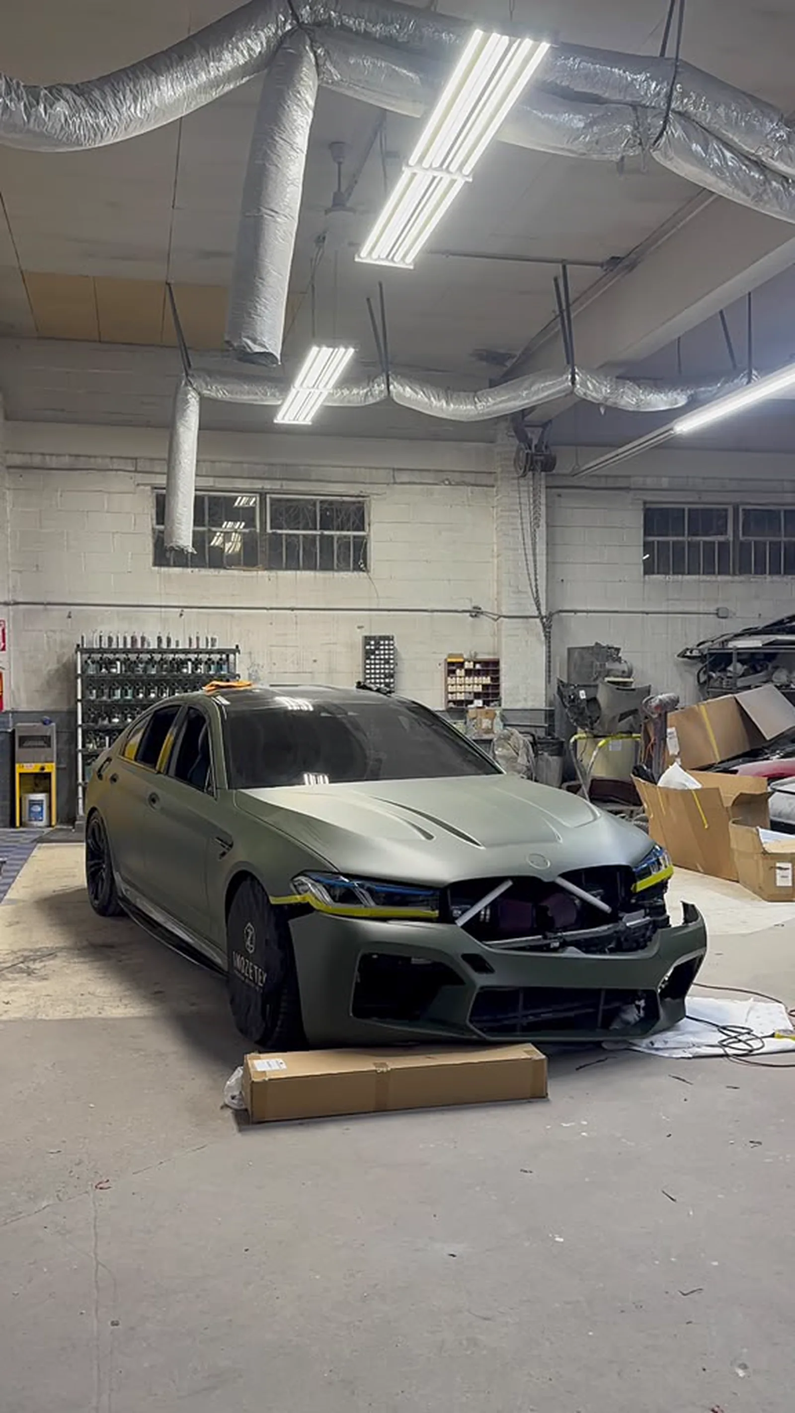 Matte military green BMW M5 mid-wrap