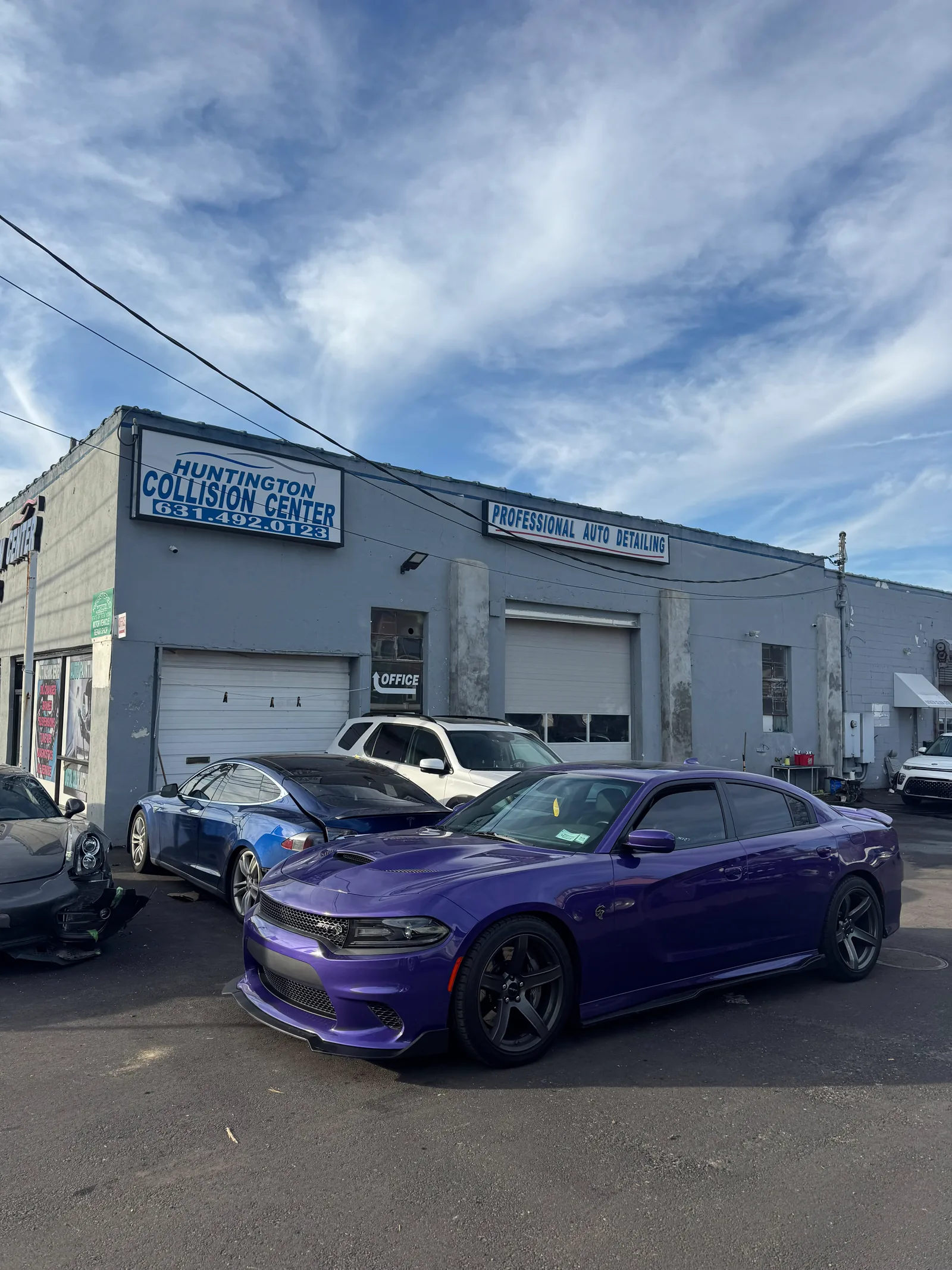 Customer cars parked in the Huntington Collision lot